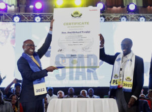 Jimmy Wanjigi receives certificate of nomination from Safina Party leader Paul Muite at Bomas of Kenya on March 21, 2022.